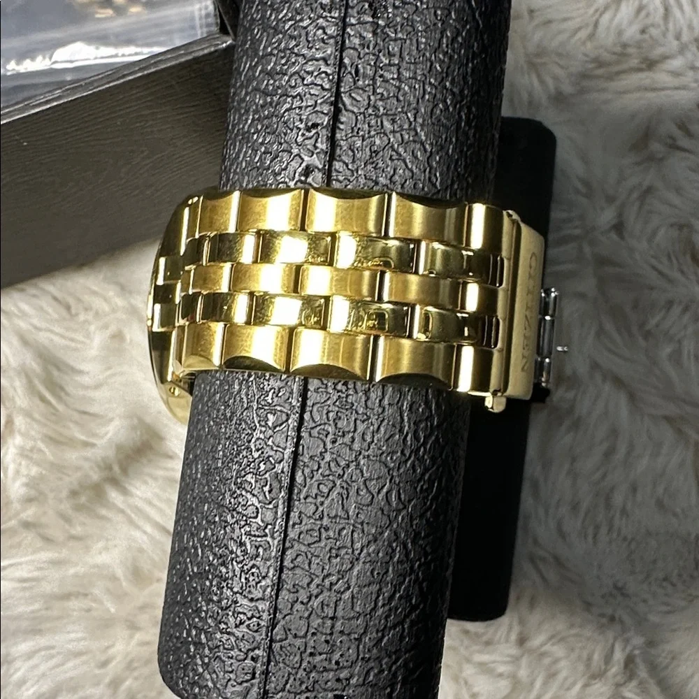 Citizen Gold Timepiece with Black Face